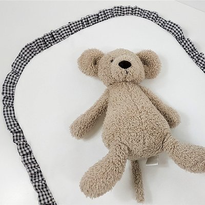 Bajera acolchada con volante para capazo